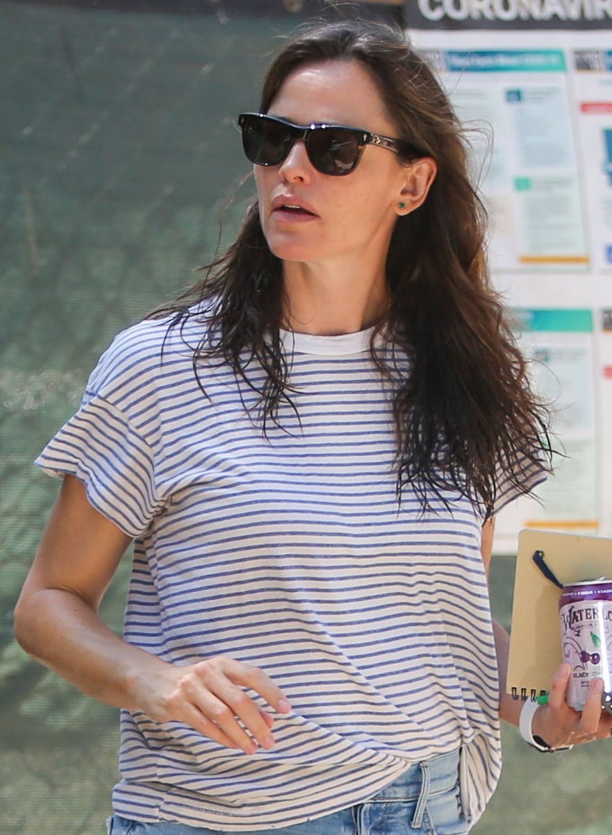 Jennifer Garner wears her damp hair down and hides her eyes behind a pair of Jacques Marie Mage Fitzgerald sunglasses