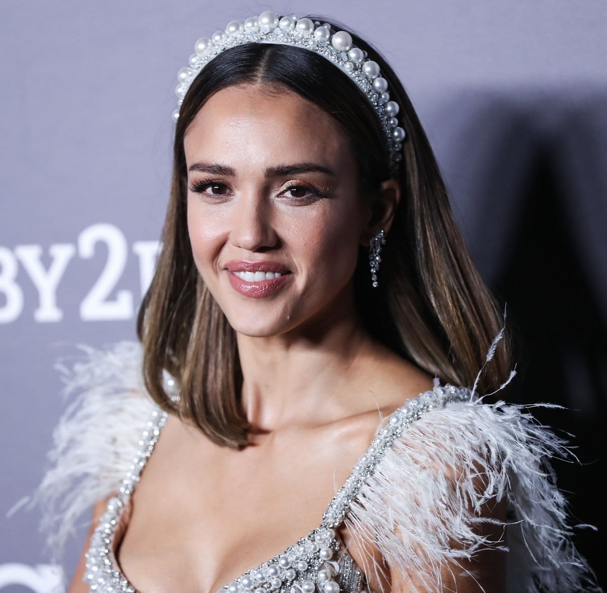 Jessica Alba wears three sets of diamond earrings from Anita Ko