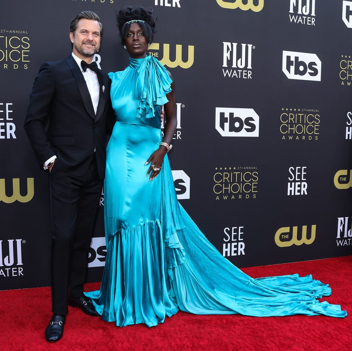 Jodie Turner-Smith, in a bright blue Gucci dress with Bulgari jewelry, was joined by her husband Joshua Jackson at the 27th Annual Critics Choice Awards