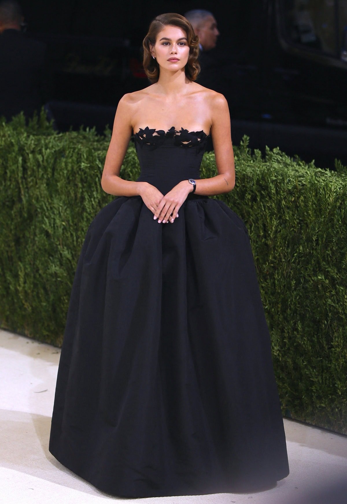 Kaia Gerber channels old Hollywood glamour in a strapless black Oscar de la Renta ballgown at her first-ever Met Gala appearance