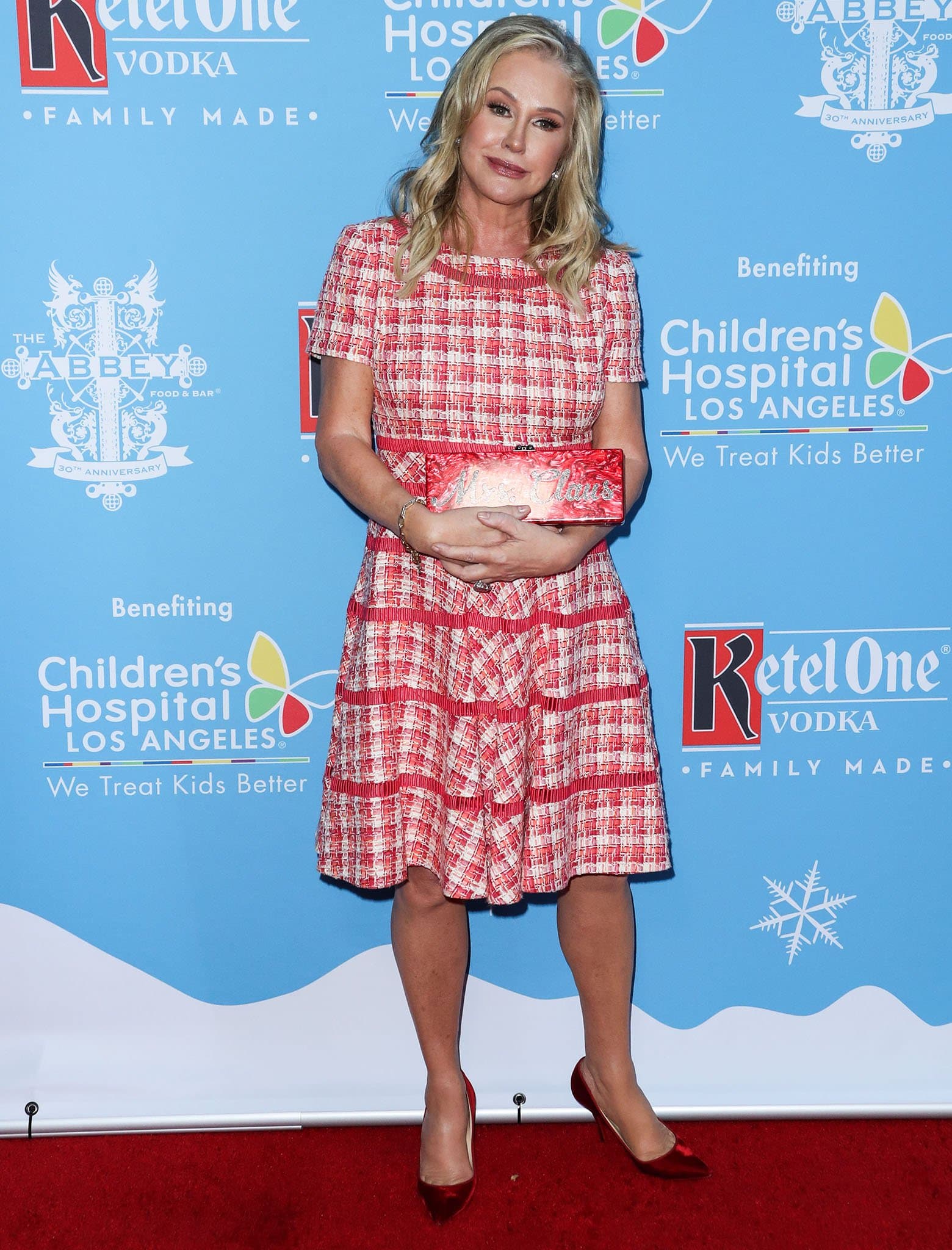 Kathy Hilton looks pretty in her red-and-white plaid tweed mini dress with matching red clutch and pumps