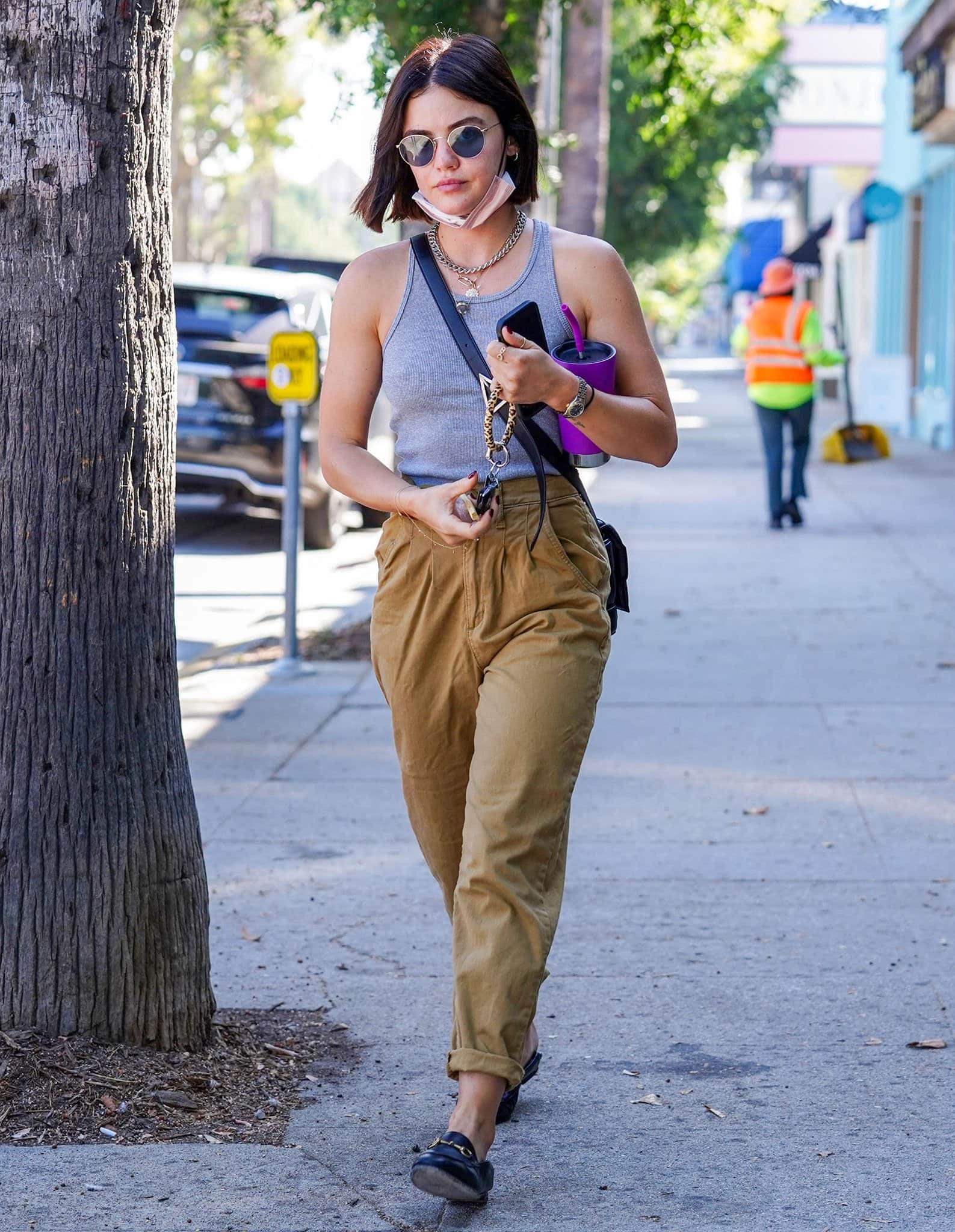 Lucy Hale looks chic in a gray tank top with baggy khaki pants while out and about in Los Angeles on September 14, 2021