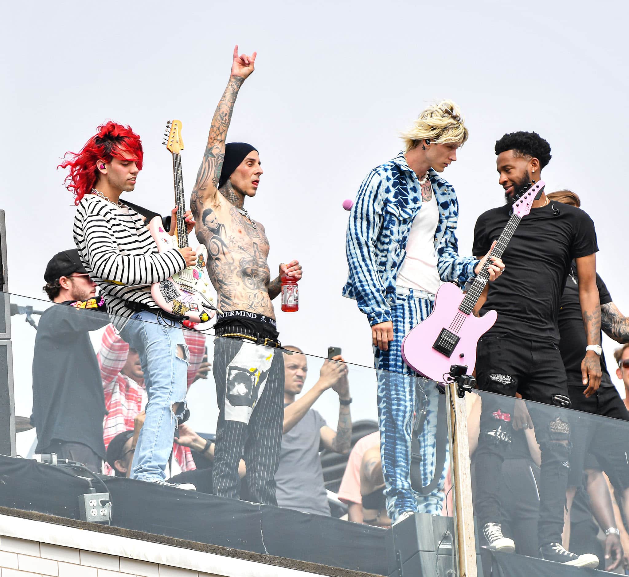 Omer Fedi performing with Machine Gun Kelly and Travis Barker in celebration of MKG's album going platinum on June 19, 2021