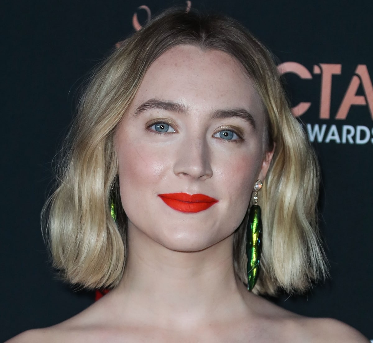 Saoirse Ronan wearing Jacquie Aiche pave diamond opal and beetle wing earrings