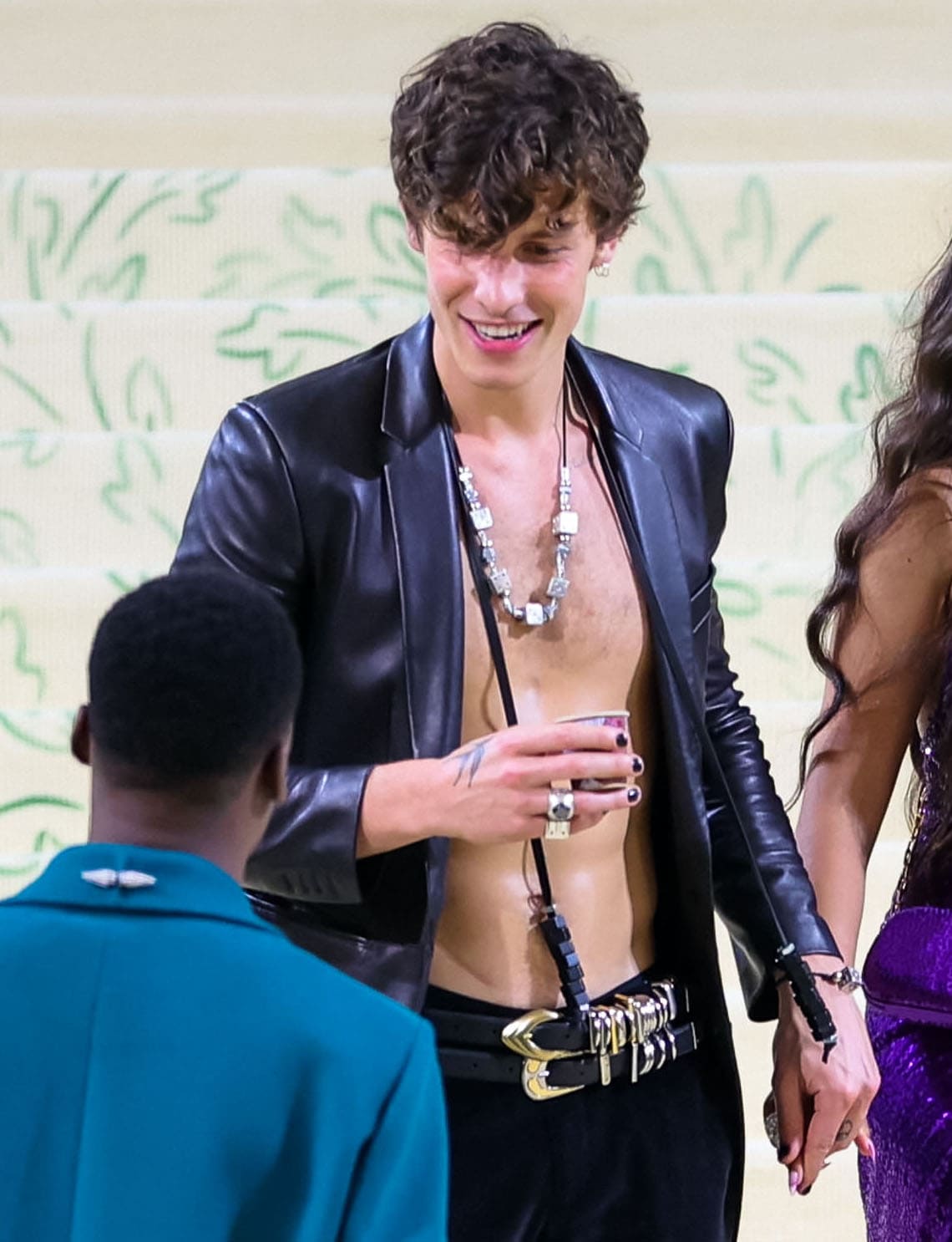 Shawn Mendes is shirtless underneath his Michael Kors jacket