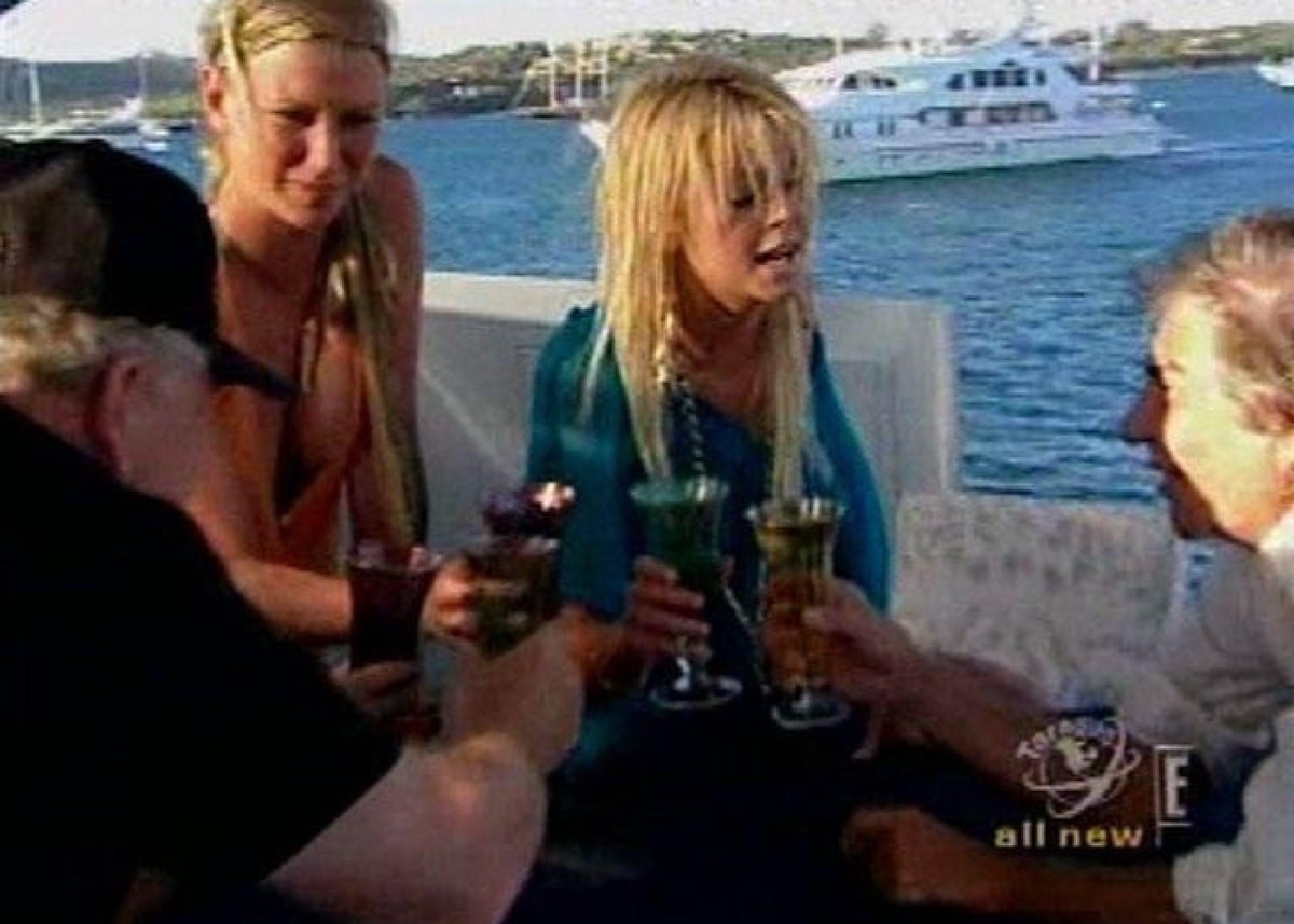 Tara Reid enjoys a drink onboard designer Roberto Cavalli's yacht in an episode of Taradise