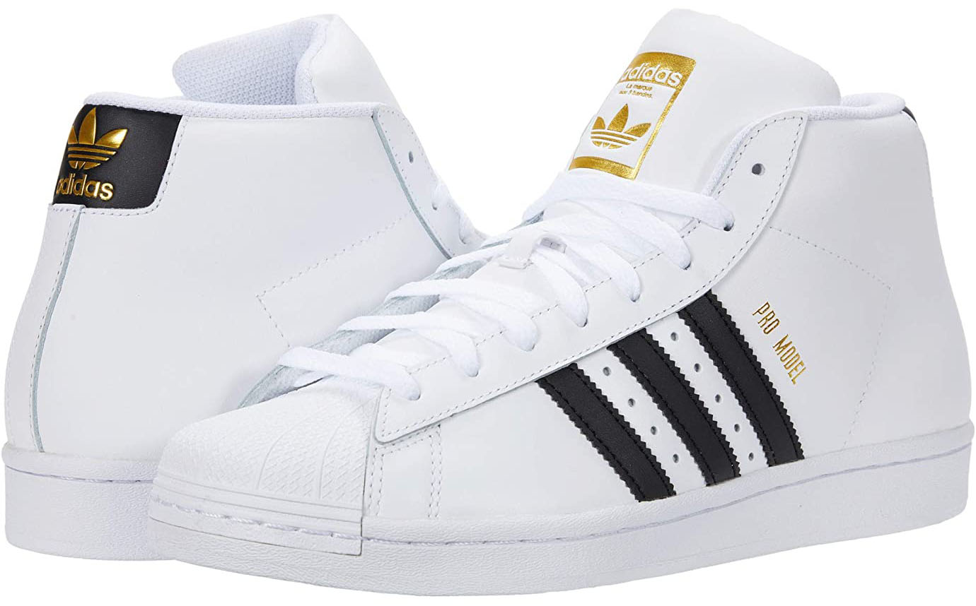 The Adidas Pro Model mid sneaker features classic logo branding on the rear and quarter panels