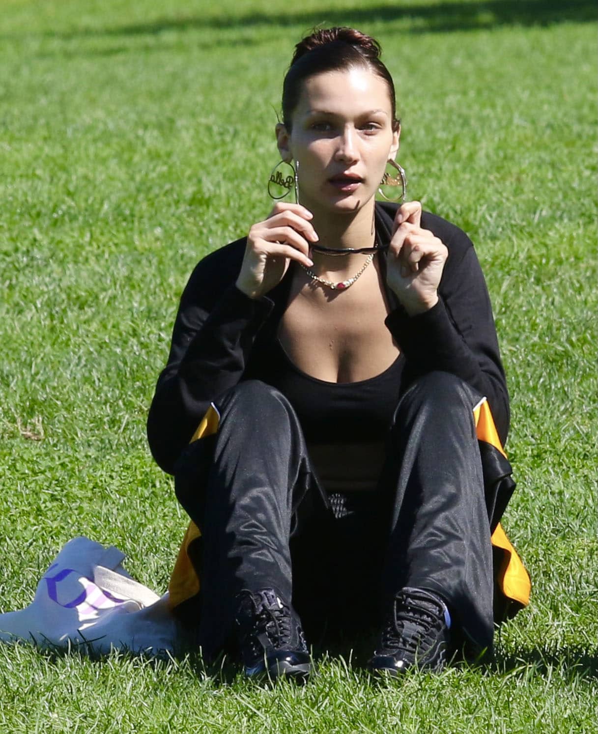 Bella Hadid wears barely-there makeup and pulls her hair back with Emi Jay Big Effing clip