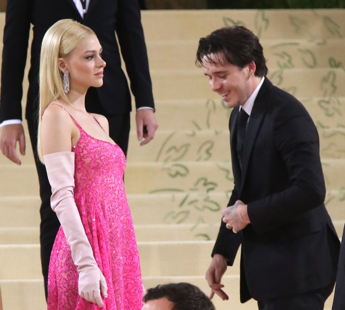 Nicola Peltz styled her sparkling pink Valentino dress with baby pink gloves and sparkling earrings