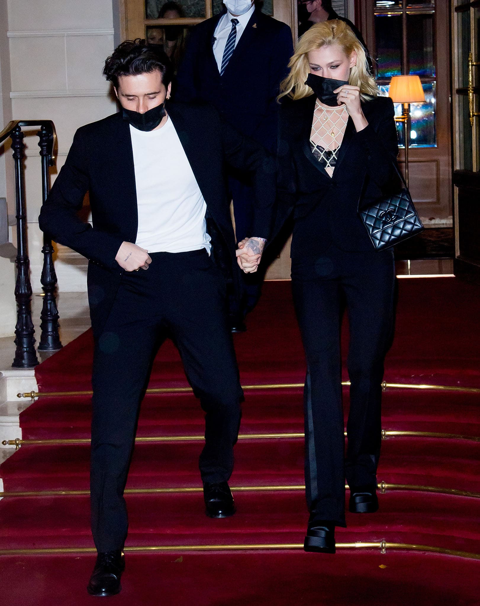 Brooklyn Beckham and Nicola Peltz leaving Ritz hotel in Paris in matching black suits on October 2, 2021