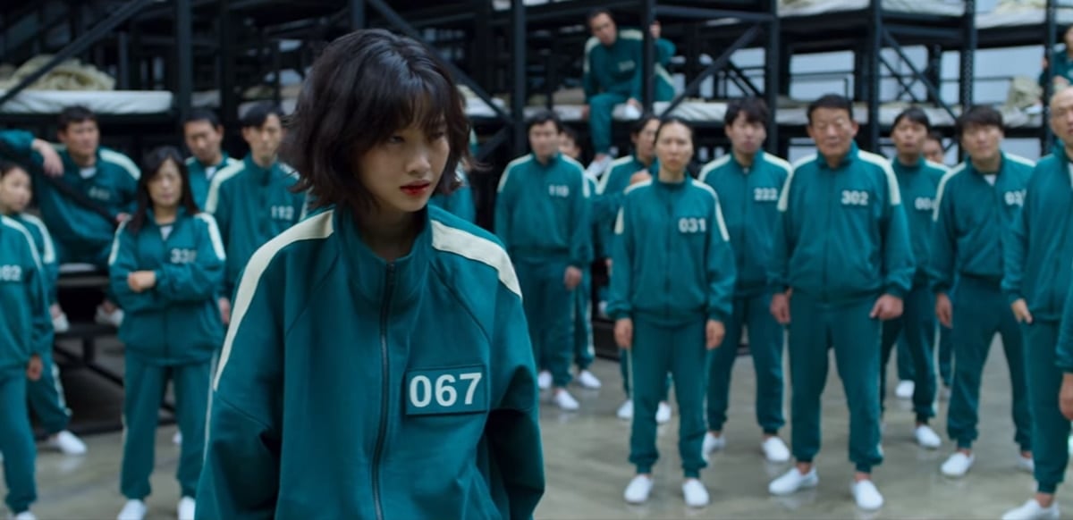 Contestants in the South Korean survival drama television series Squid Game wear green tracksuits and white sneakers