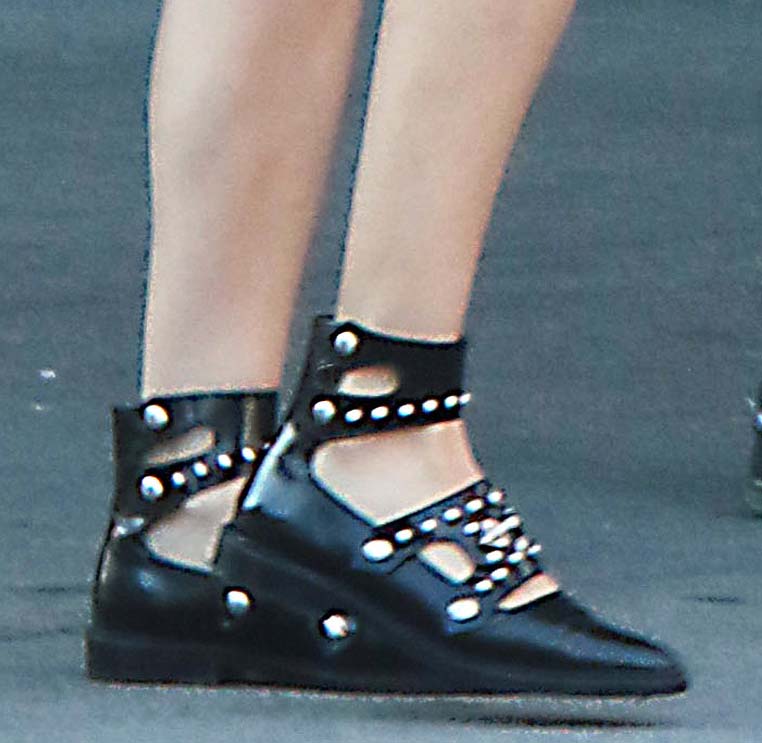 Diane Kruger completes her street-chic outfit with black studded flats