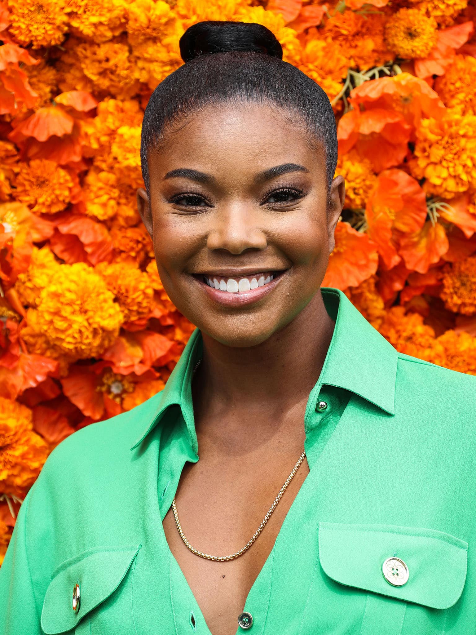 Gabrielle Union pulls her tresses back into a bubble ponytail and highlights her features with neutral makeup