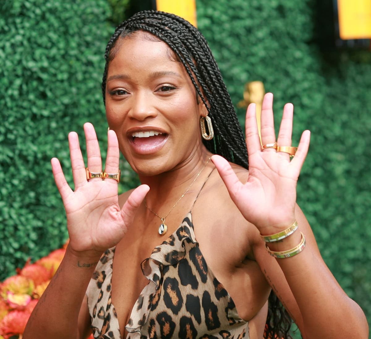 Keke Palmer stuns in a bold animal-print dress paired with chic gold accessories