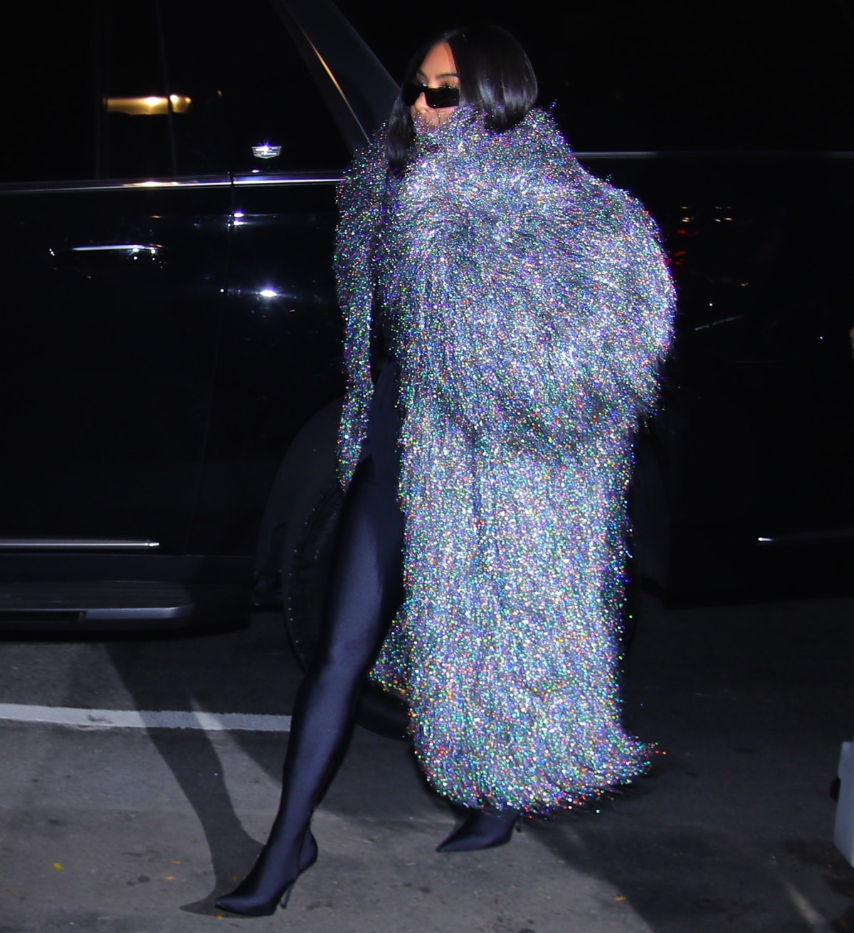 Kim Kardashian arrives at her 1st SNL host dinner in an amazing 70's inspired look in New York City