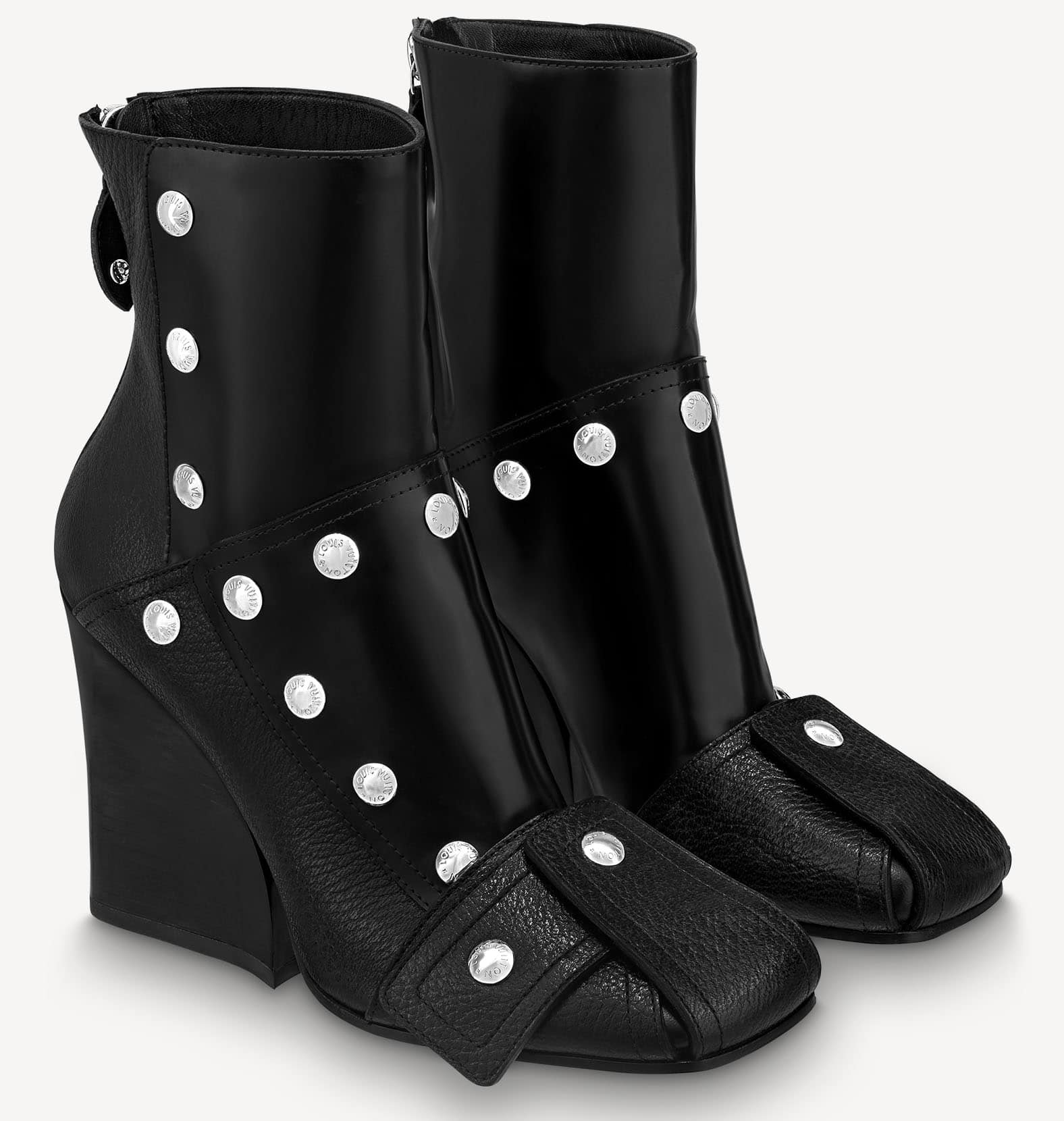 Louis Vuitton's Patti wedge boots feature a contemporary silhouette with engraved silver studs, square toes, and high wedge heels