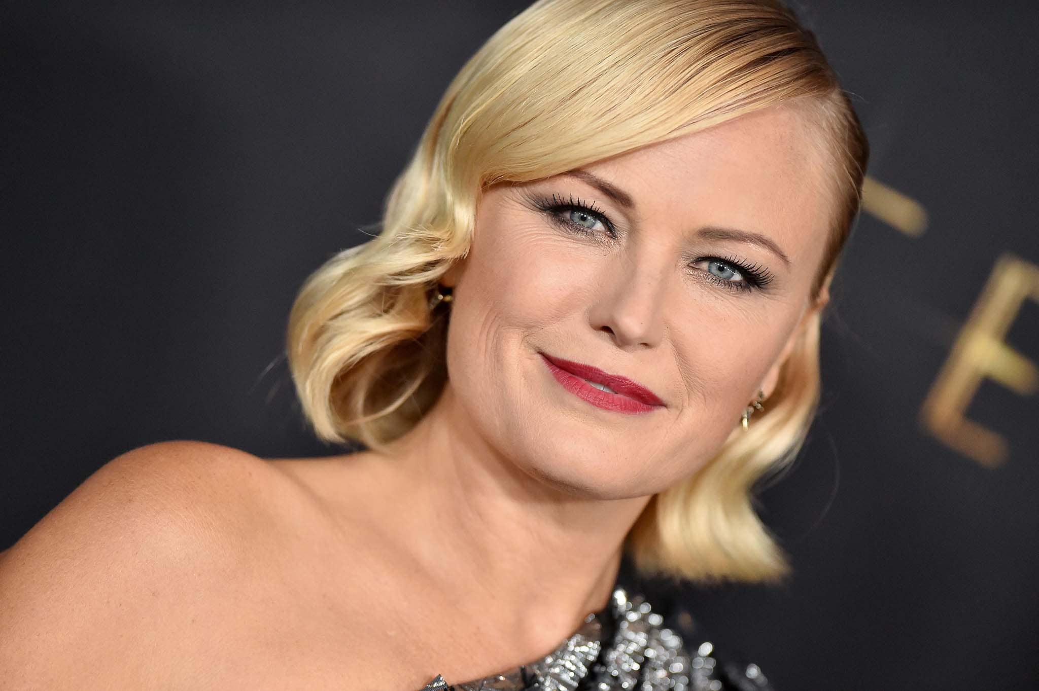Malin Akerman adds retro glam to her ultra-modern outfit with old Hollywood waves and red lipstick