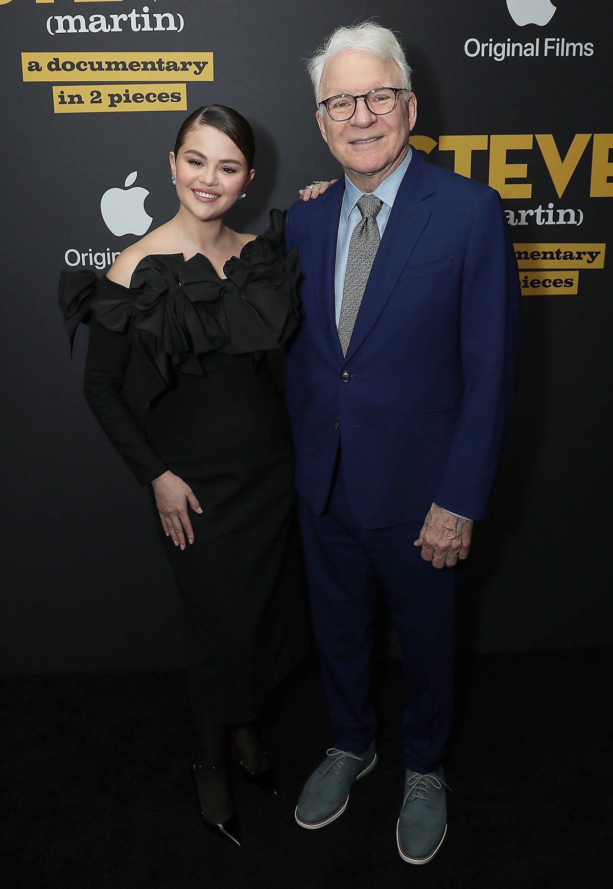 Selena Gomez expertly enhances her petite frame with towering Christian Louboutin pumps, standing confidently next to the taller Steve Martin at the 'STEVE! (Martin): A Documentary in 2 Pieces' premiere