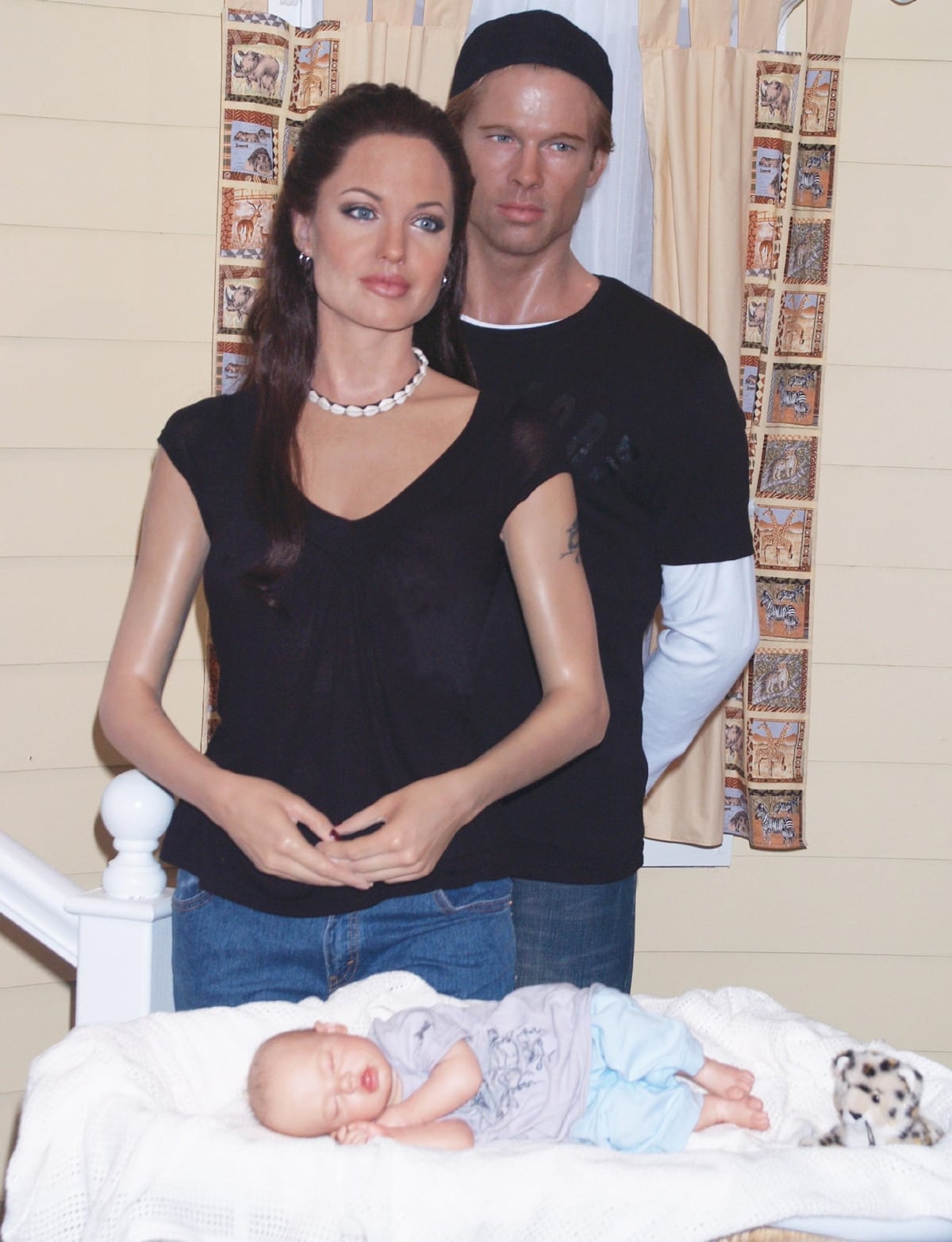 The African-themed Shiloh exhibit at Madame Tussauds Wax Museum shows Shiloh Jolie-Pitt sleeping, while her parents, Angelina Jolie and Brad Pitt, watch over her