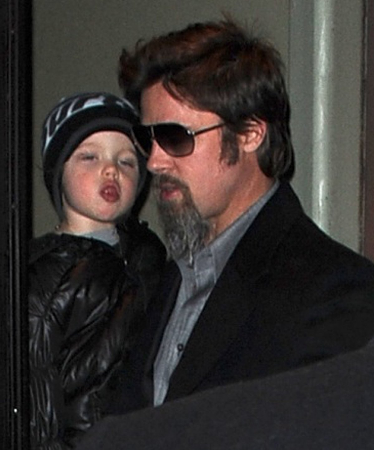 Brad Pitt carries daughter Shiloh Jolie-Pitt as he leaves the Broadway showing of Mary Poppins in New York City