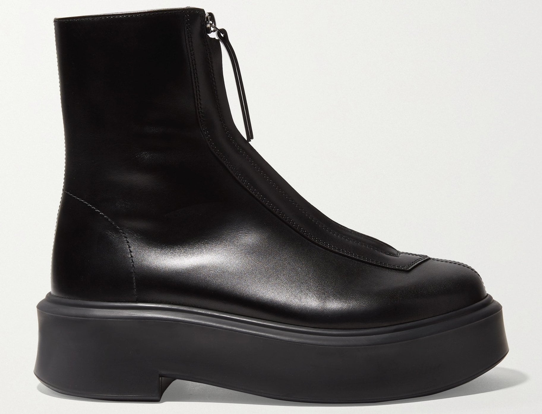 A combat-inspired ankle boot made from supple leather with a front zipper and a chunky sole