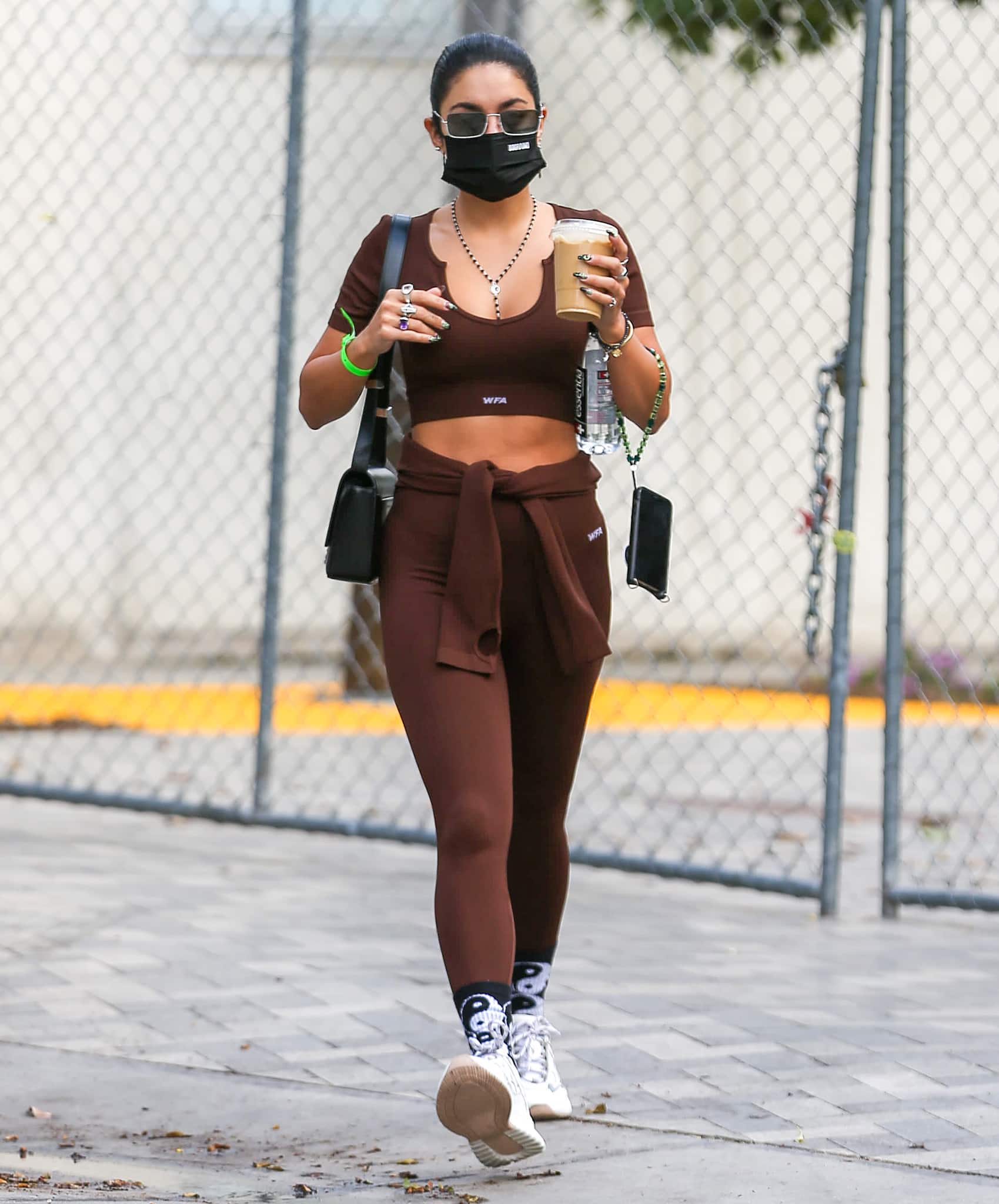 Vanessa Hudgens flaunts her abs in a brown White Fox Boutique crop top and leggings