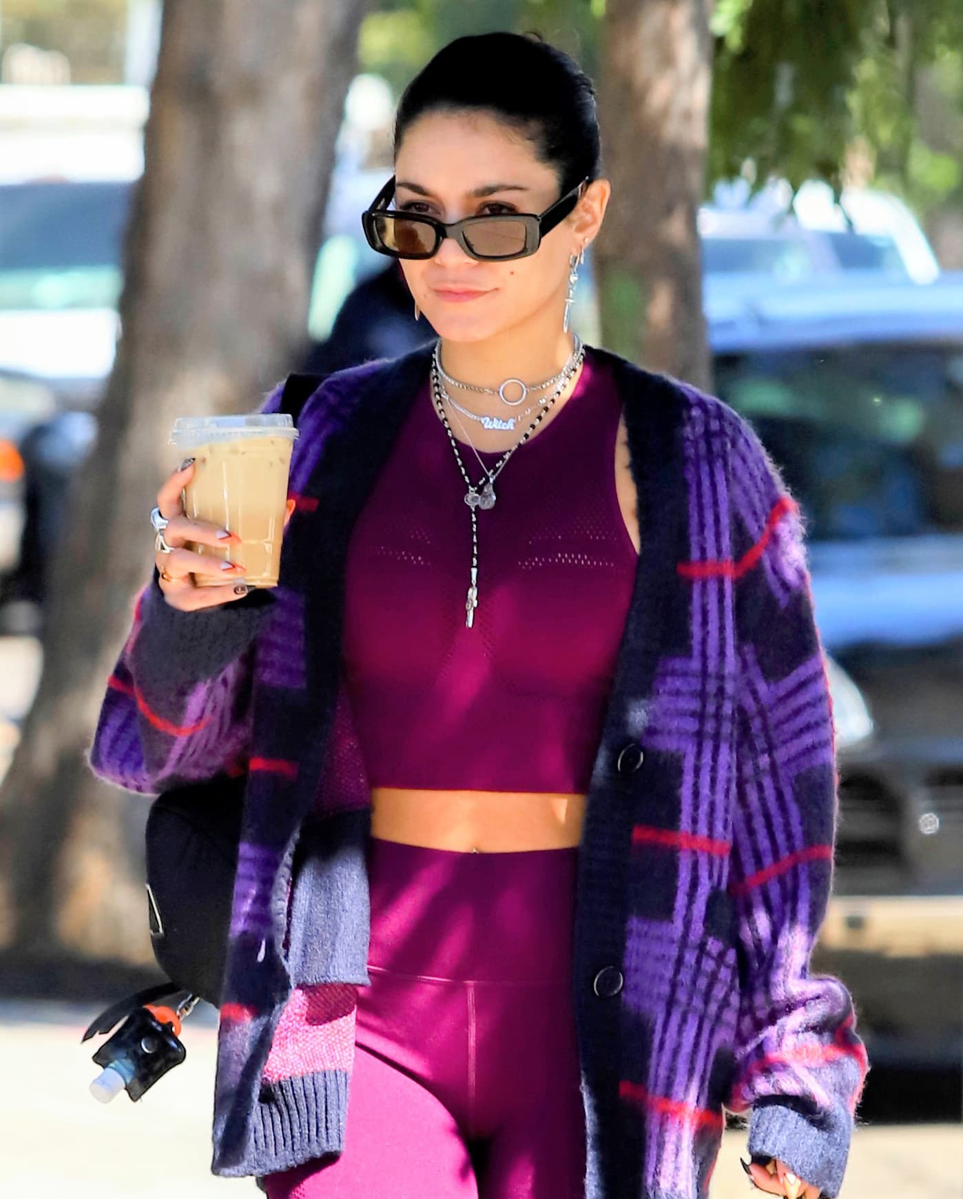 Vanessa Hudgens adds bling to her sportswear with several necklaces, earrings, and rings