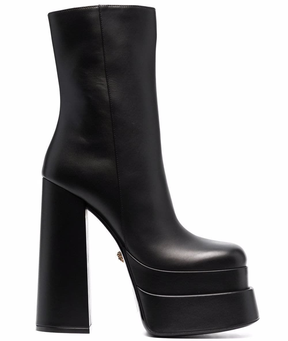 Versace's leather boots feature towering block heels and chunky platforms with contemporary square toes