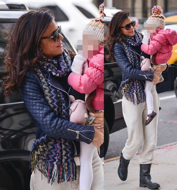 Bethenny Frankel wears a zigzag patterned scarf with sweatpants and a quilted jacket