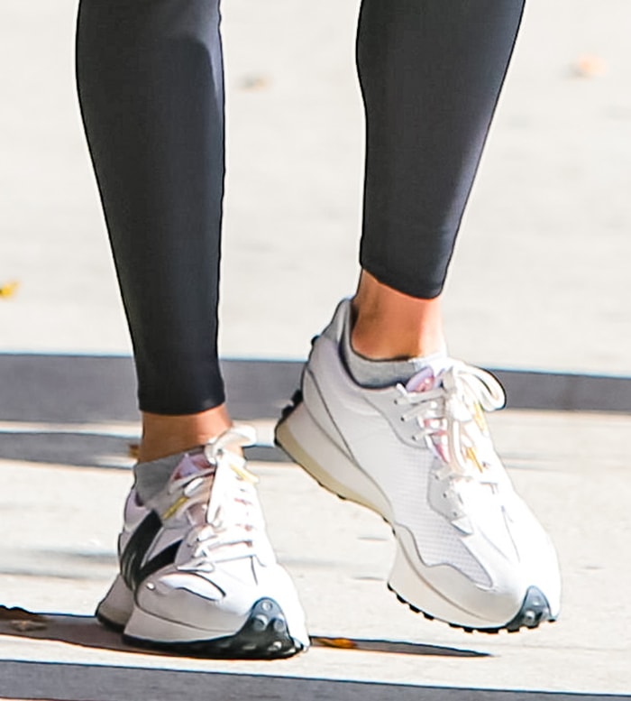 Alessandra Ambrosio finishes off her workout look with Casablanca x New Balance 327 sneakers