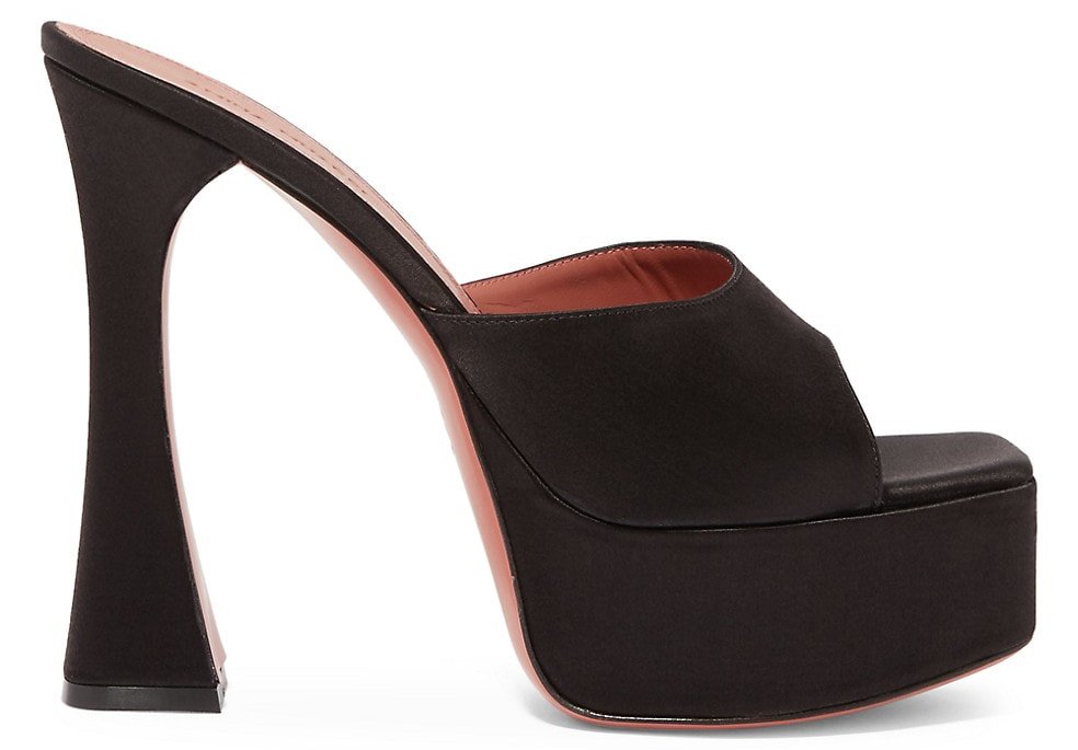 The staggering curved heel defines the Amina Muaddi Dalida mule sandals