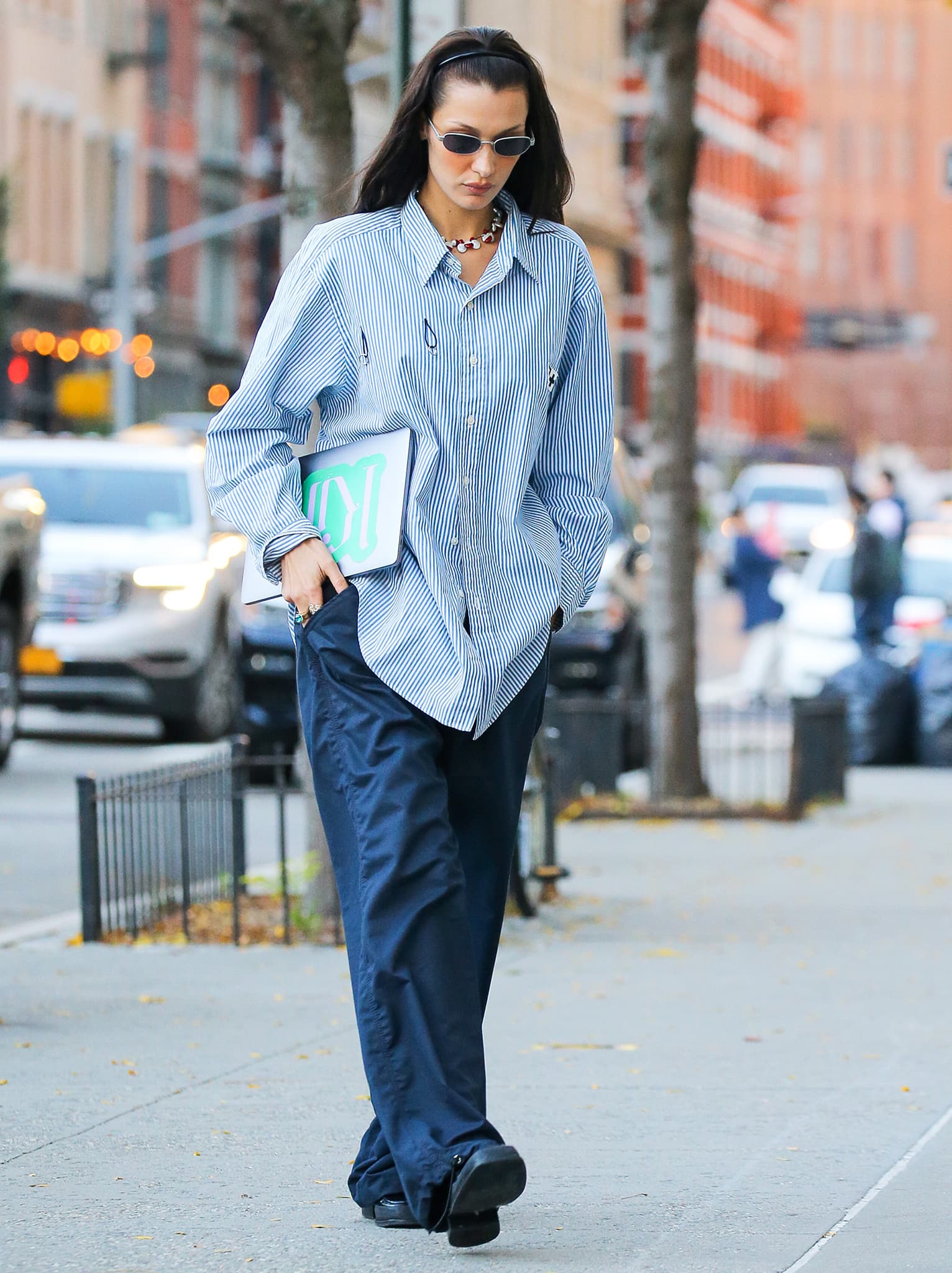 Bella Hadid goes business-casual in Foo & Foo oversized striped shirt and Eytys baggy pants