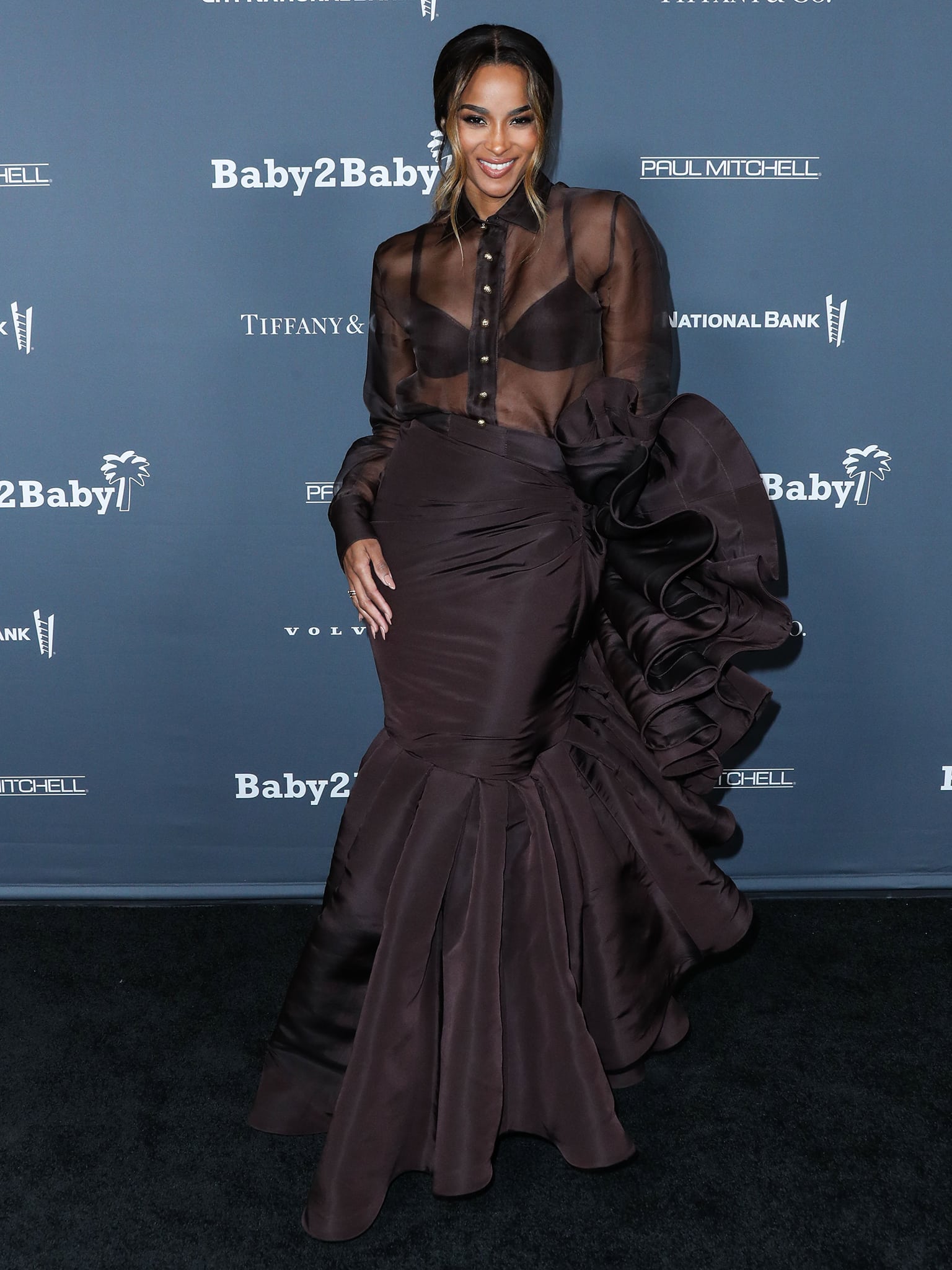 Ciara shows a hint of flesh in a see-through sheer gown with ruffled, mermaid skirt from Ashi Studio Fall/Winter 2021 Couture collection
