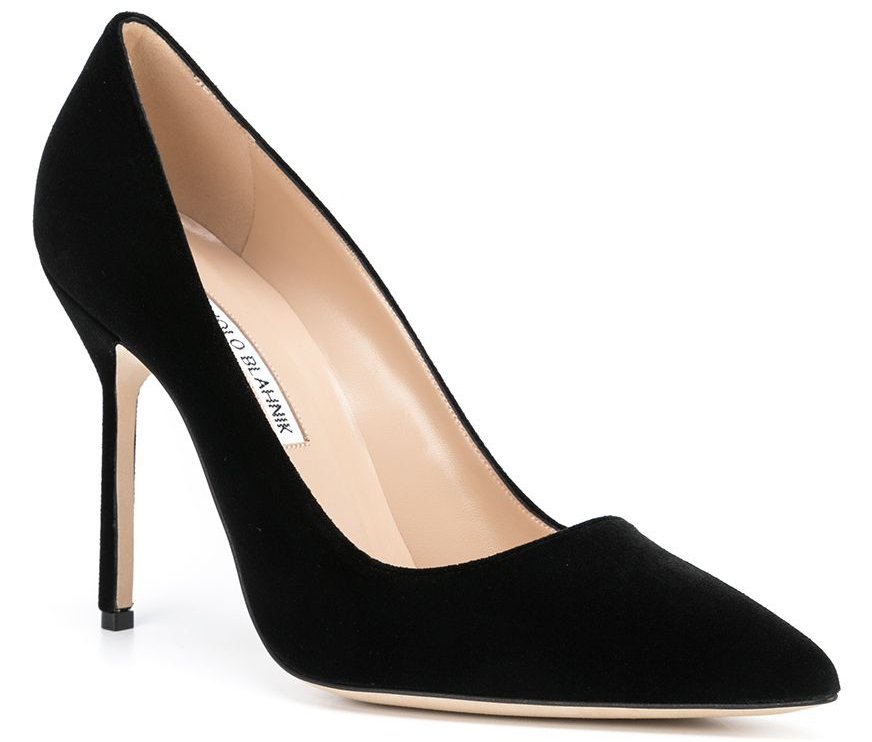 A classic pair of pumps crafted from black suede with pointed toes and high stiletto heels