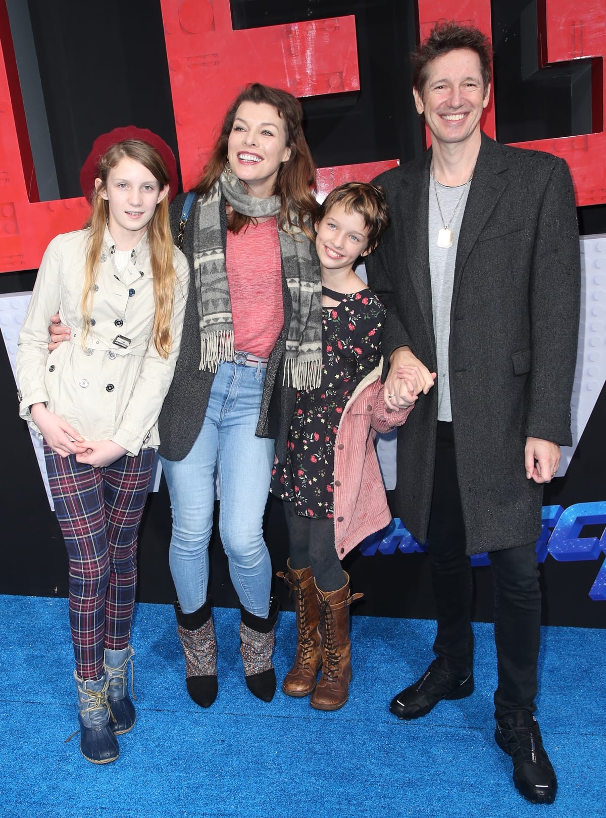 Milla Jovovich, Paul W. S. Anderson, daughter Ever Anderson, and a young guest attend the premiere of The Lego Movie 2: The Second Part