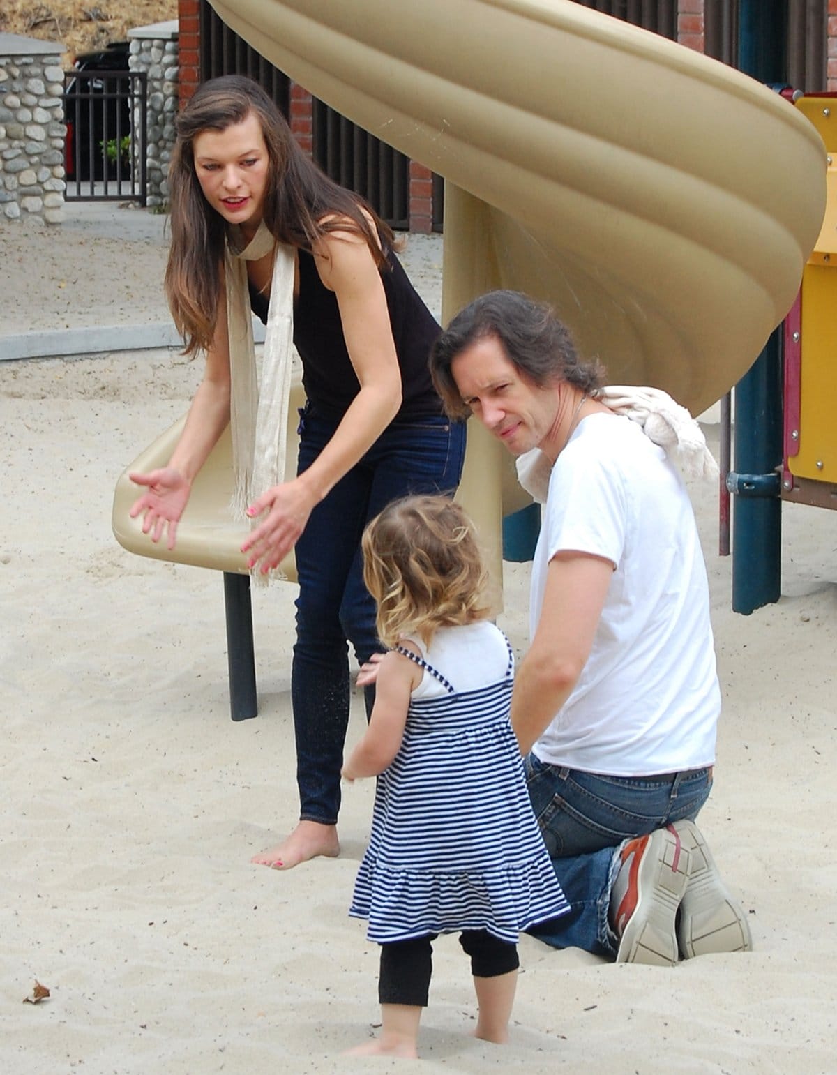 Milla Jovovich and Paul William Scott Anderson play with their daughter, Ever Gabo Anderson at Beverly Hills Park