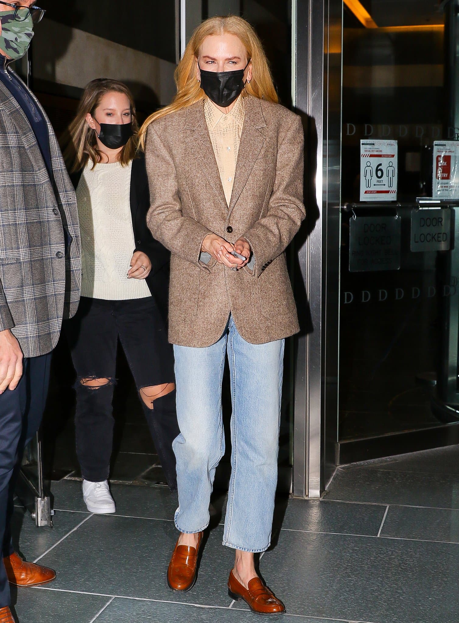 Nicole Kidman wears a grandpa-style outfit with brown blazer, straight-leg jeans, and cognac brown loafers at the post-screening Q&A of Being the Ricardos in New York City on November 17, 2021