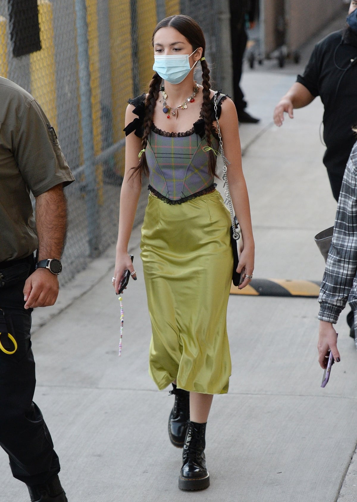 Olivia Rodrigo arrives in a No Dress satin skirt and a Pristine Candy tartan corset top for a taping of Jimmy Kimmel Live!