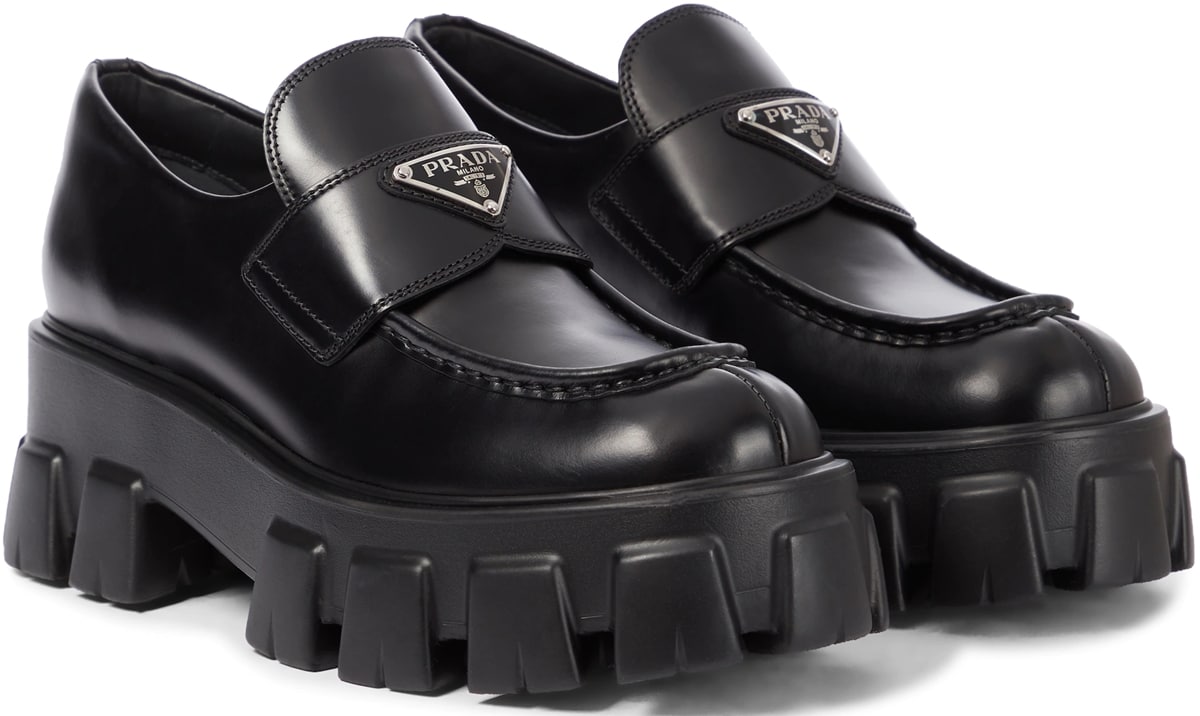 Prada's lug-soled Monolith loafers are made from the house's signature brushed leather in classic black that will go with everything