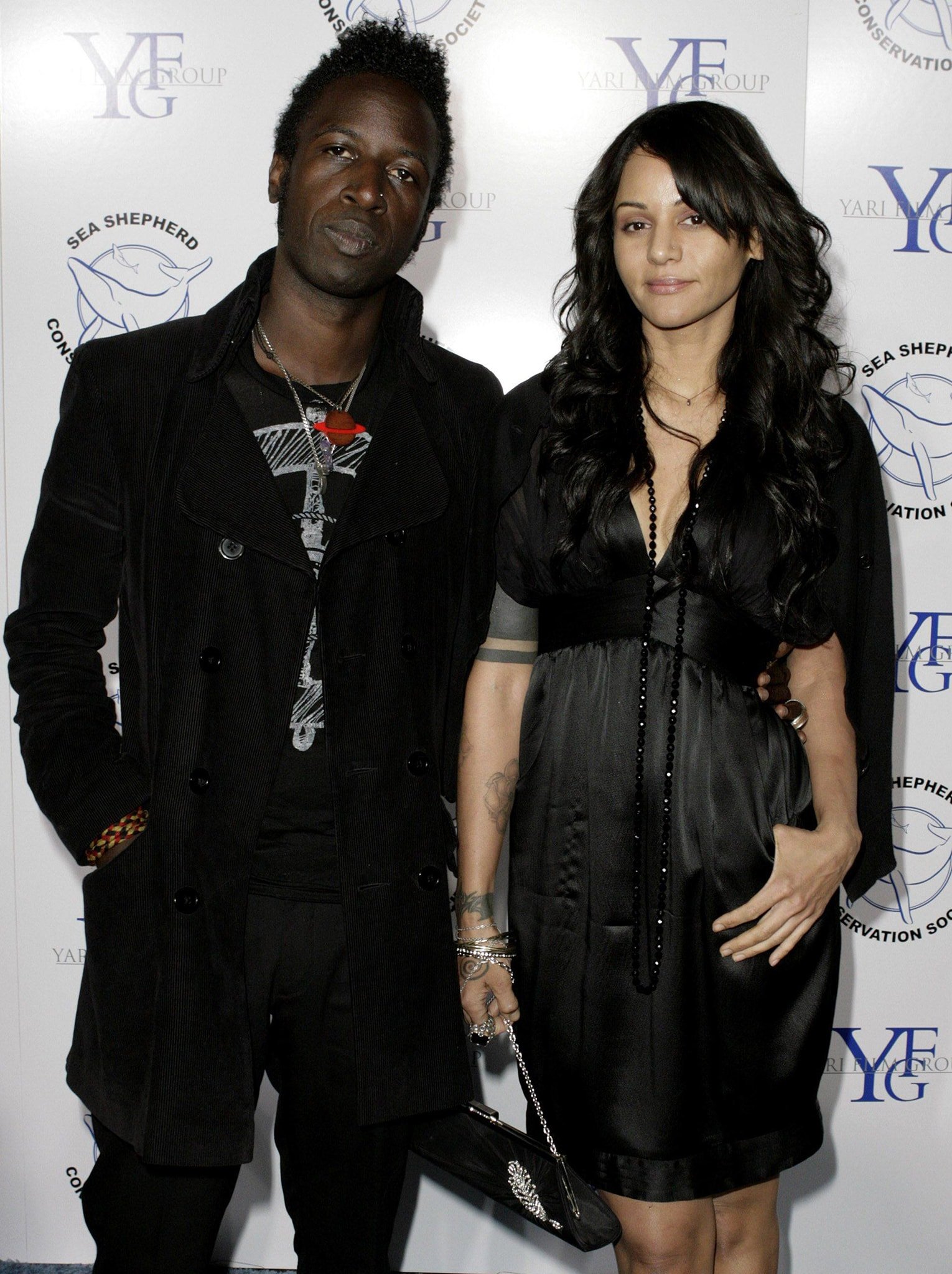 Persia White and Saul Williams attend an event together, displaying their coordinated black outfits and stylish accessories