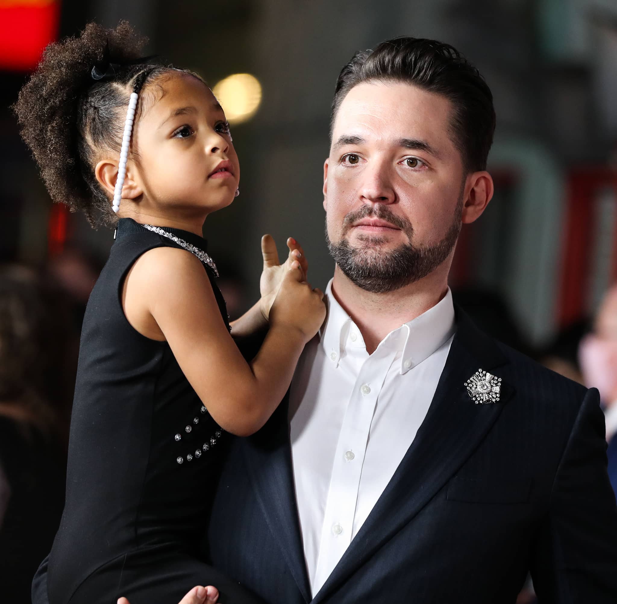 Olympia Ohanian mirrors her mom's outfit while Reddit co-founder Alexis Ohanian dons a navy pinstripe suit