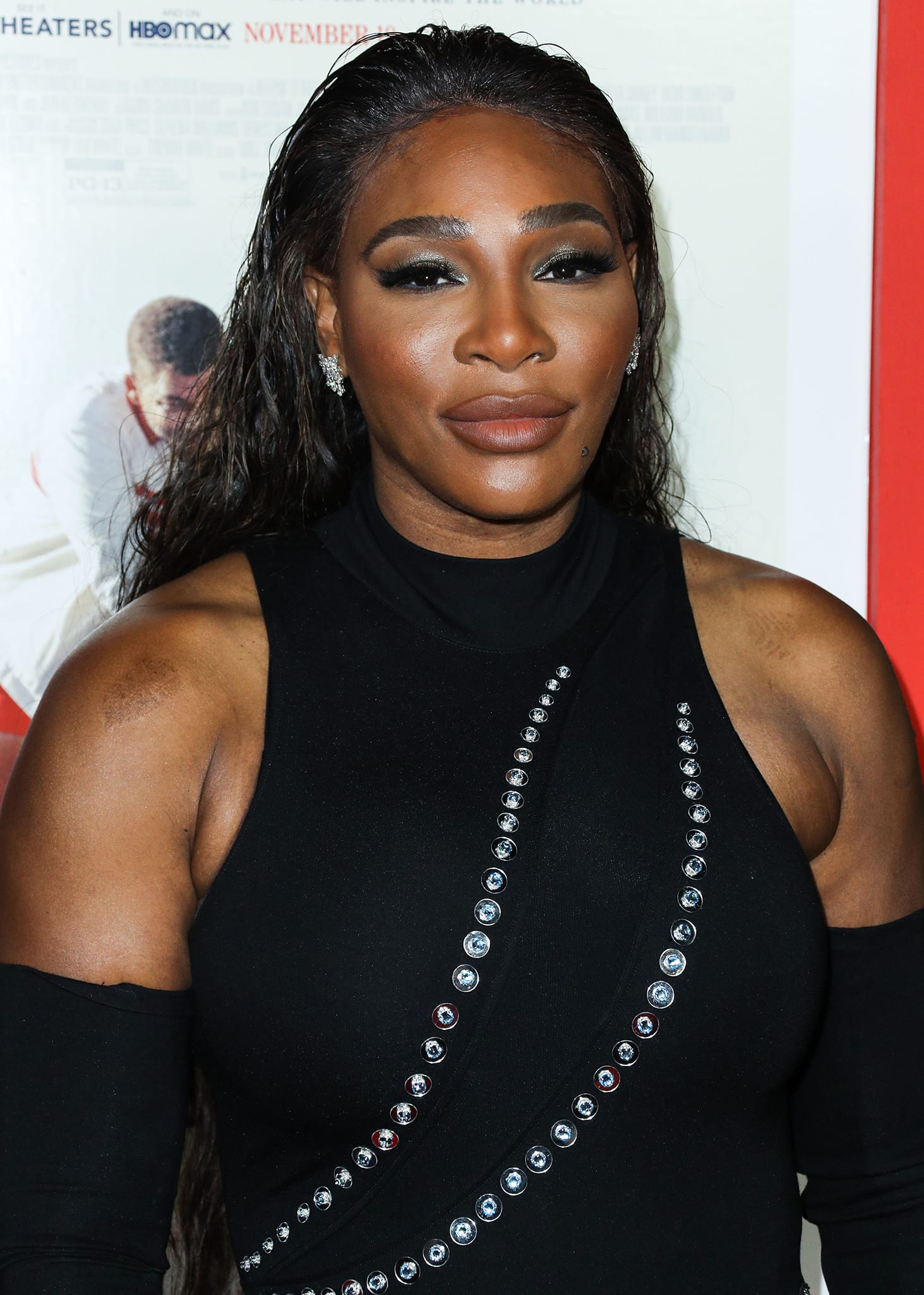 Serena Williams captivates with a sultry wet hair look, smokey eyes, and nude lips, exuding glamour