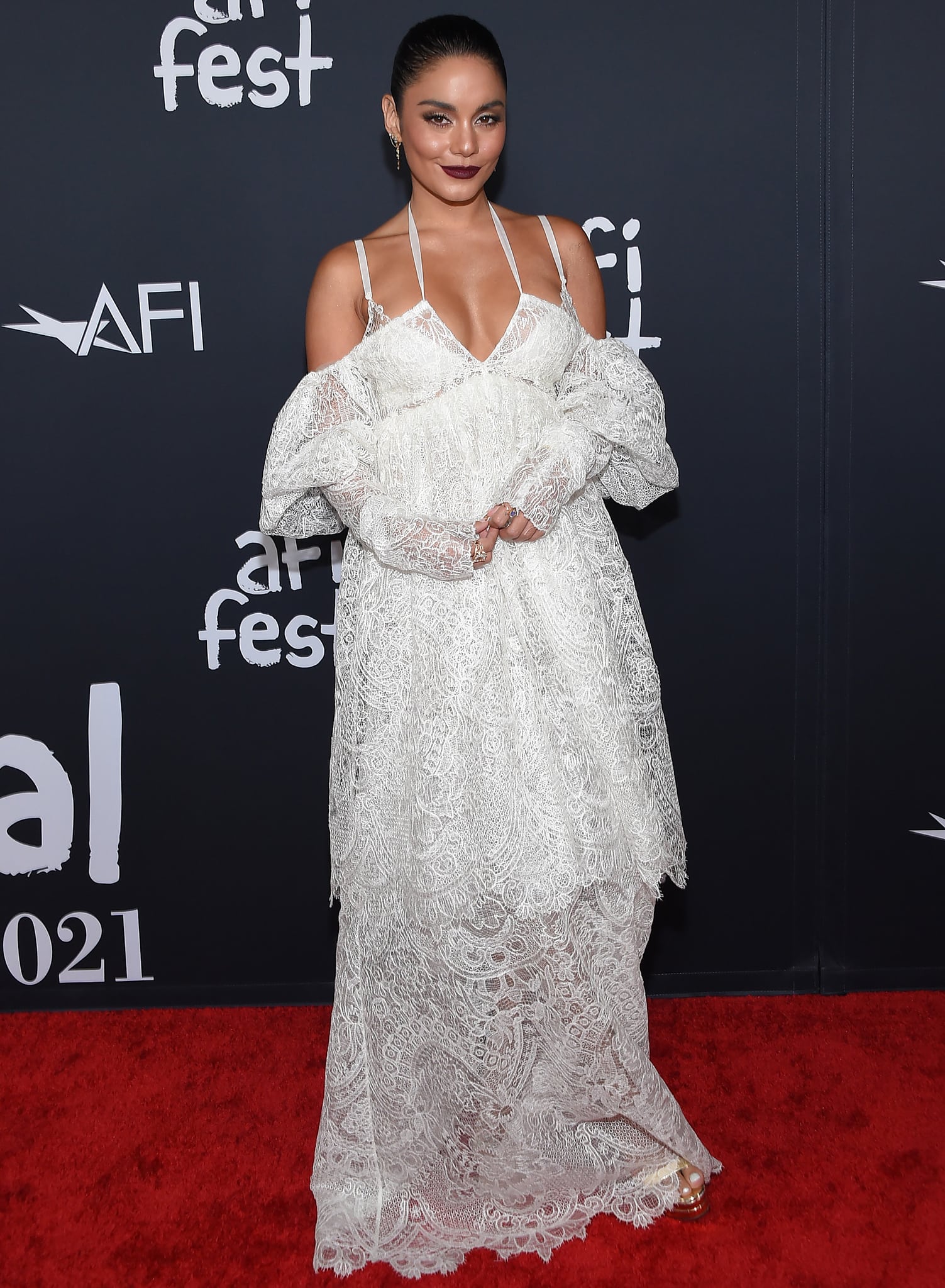 Vanessa Hudgens' dress features a plunging neckline and a tiered, floaty silhouette