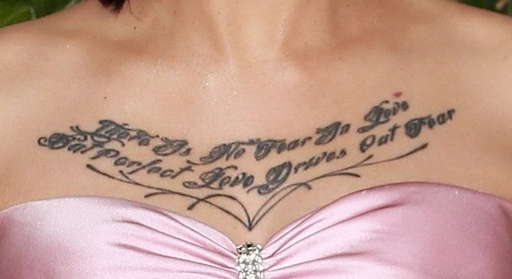 Bella Poarch has part of a 1 John 4:18 Bible verse, "There is no fear in love, but perfect love drives out fear," tattooed on her chest