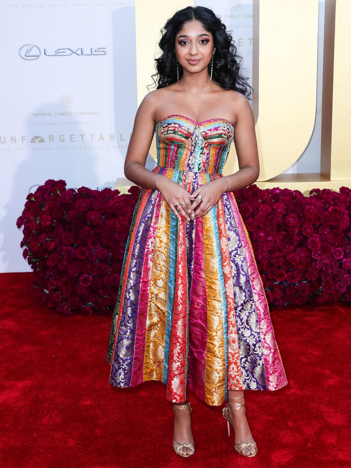 Canadian actress Maitreyi Ramakrishnan in a rainbow upcycled fabric dress from Indian designer Ashwin Thiyagarajan at the 19th Annual Unforgettable Gala Asian American Awards