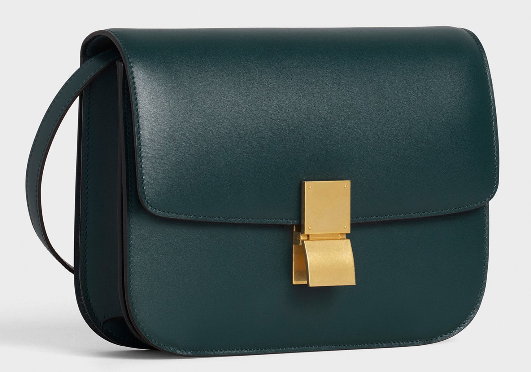 A medium classic bag that features a chic boxy silhouette, finished with metallic clasp closure