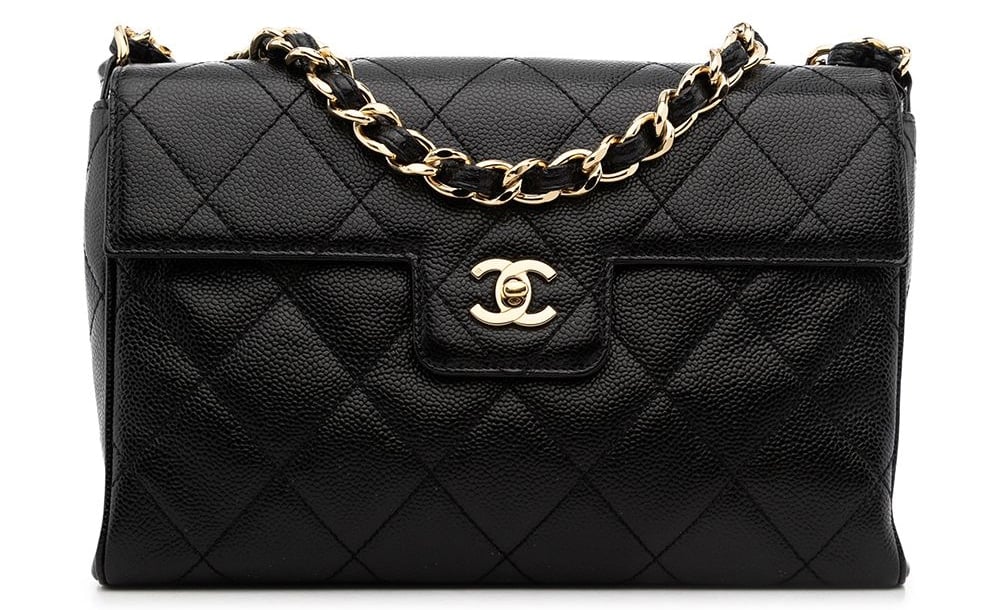 2001 medium Classic Flap shoulder bag that features the fashion house's diamond quilting, leather and chain-link shoulder strap, and the iconic interlocking CC turn-lock