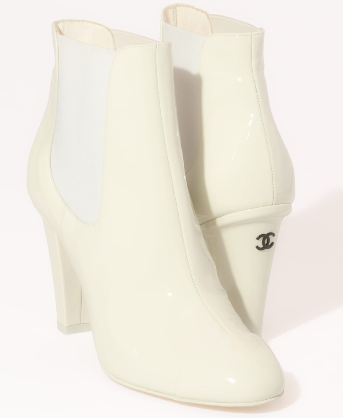 These Chanel ankle boots feature Chelsea-style elastic panels and angled heels accented with double C logo