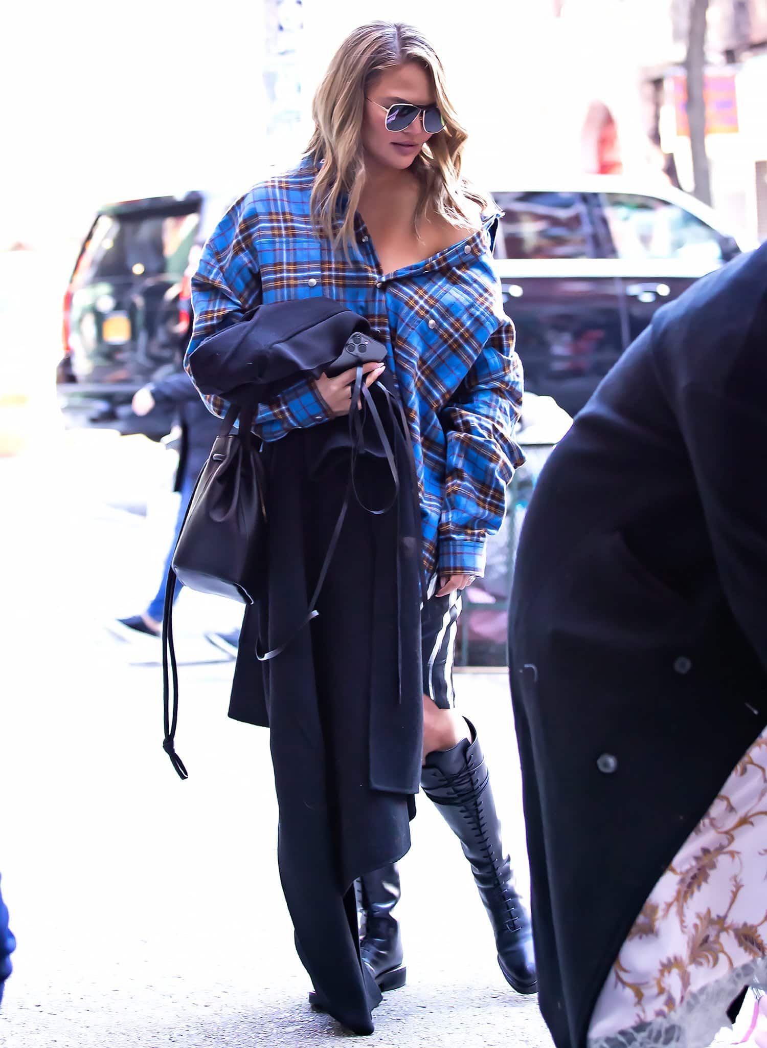 Chrissy Teigen showcases sexy grunge look in Rick Owens plaid shirt dress while grabbing lunch at Bar Pitti in NYC on December 4, 2021