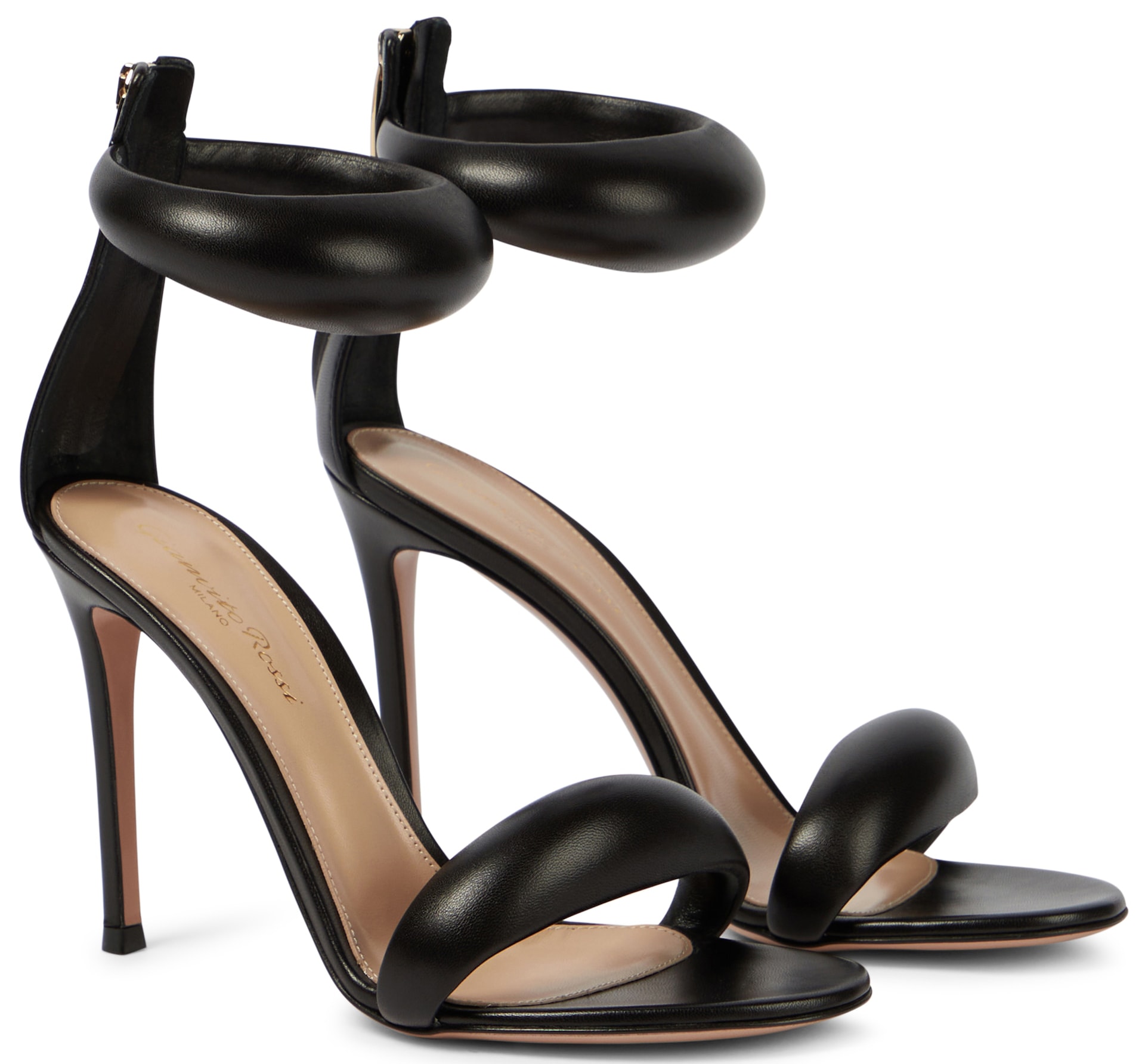 These trendy sandals feature buttery soft padded leather, a back zip, and a high stiletto heel